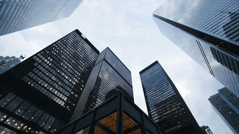 Glass office towers seen from below