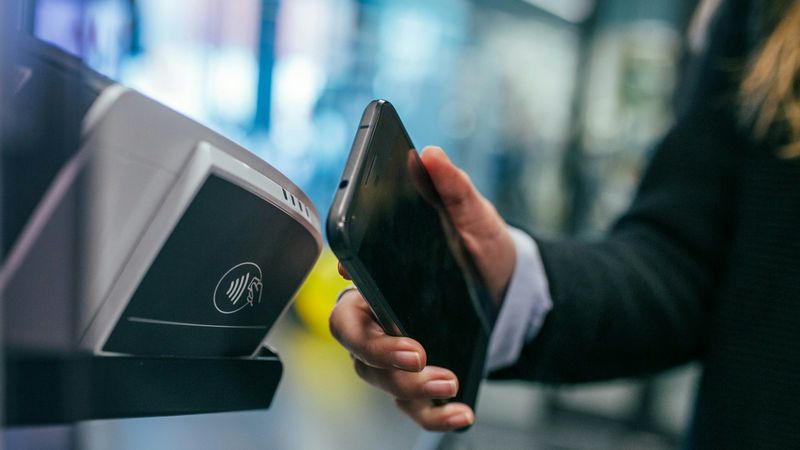 Phone tapping a contactless payment terminal