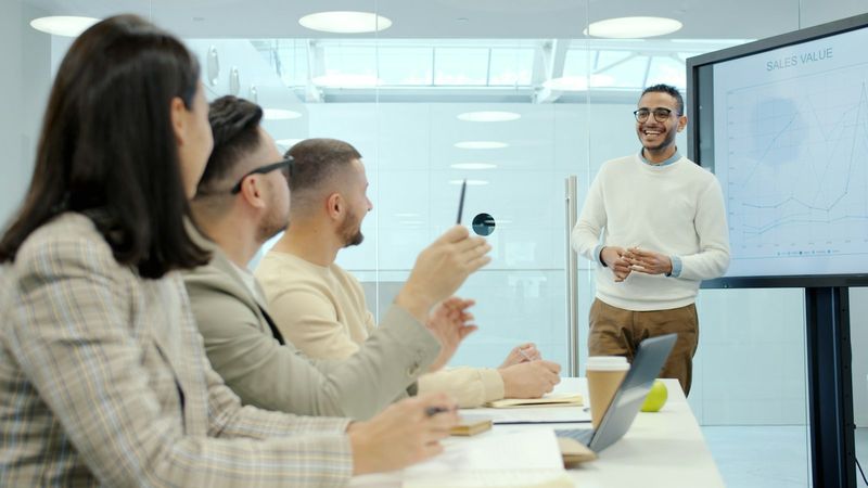 Sales team reviewing results in a modern meeting room
